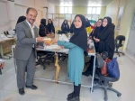 اهداء لوح تقدیر و هدیه به دانشجوی گرامی خانم عابدینی بمناسبت کسب رتبه اول  در مسابقه فرهنگی ماه مبارک رمضان و روز قدس 2